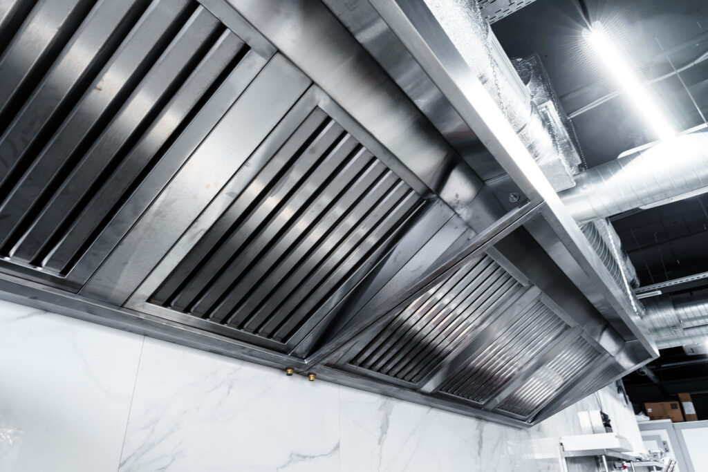 New clean stainless steel hood in professional kitchen